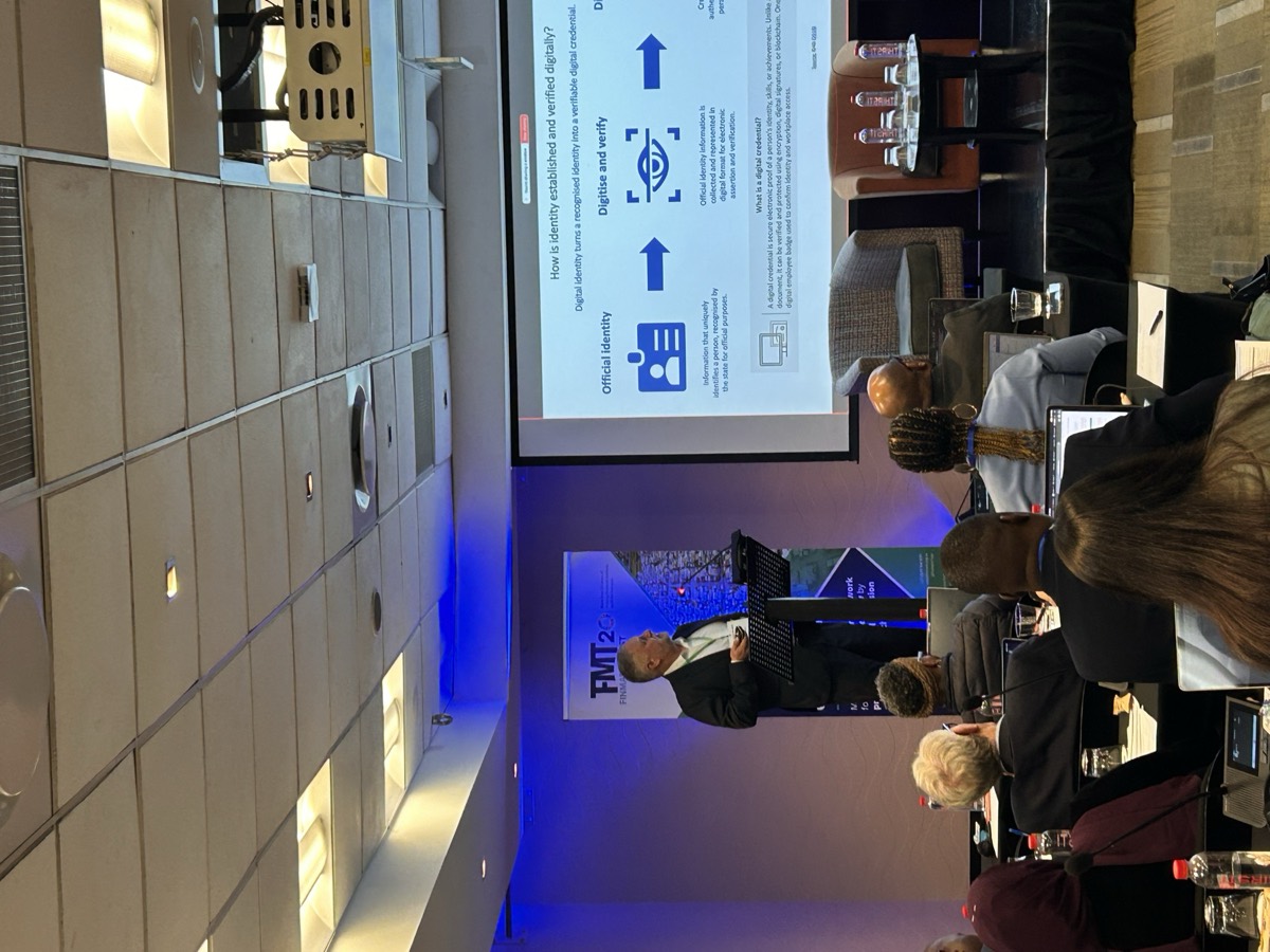 A speaker presenting on how digital identity is established and verified